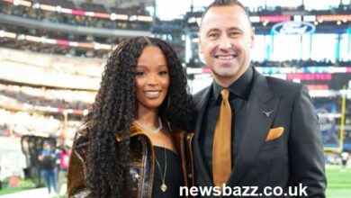 “Stephanie Sarkisian smiling at a public event, showing her calm and confident personality.”